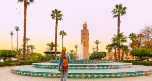 Woman,Looking,At,Koutoubia,Mosque,Minaret-tourism,In,Marrakech,,Morocco